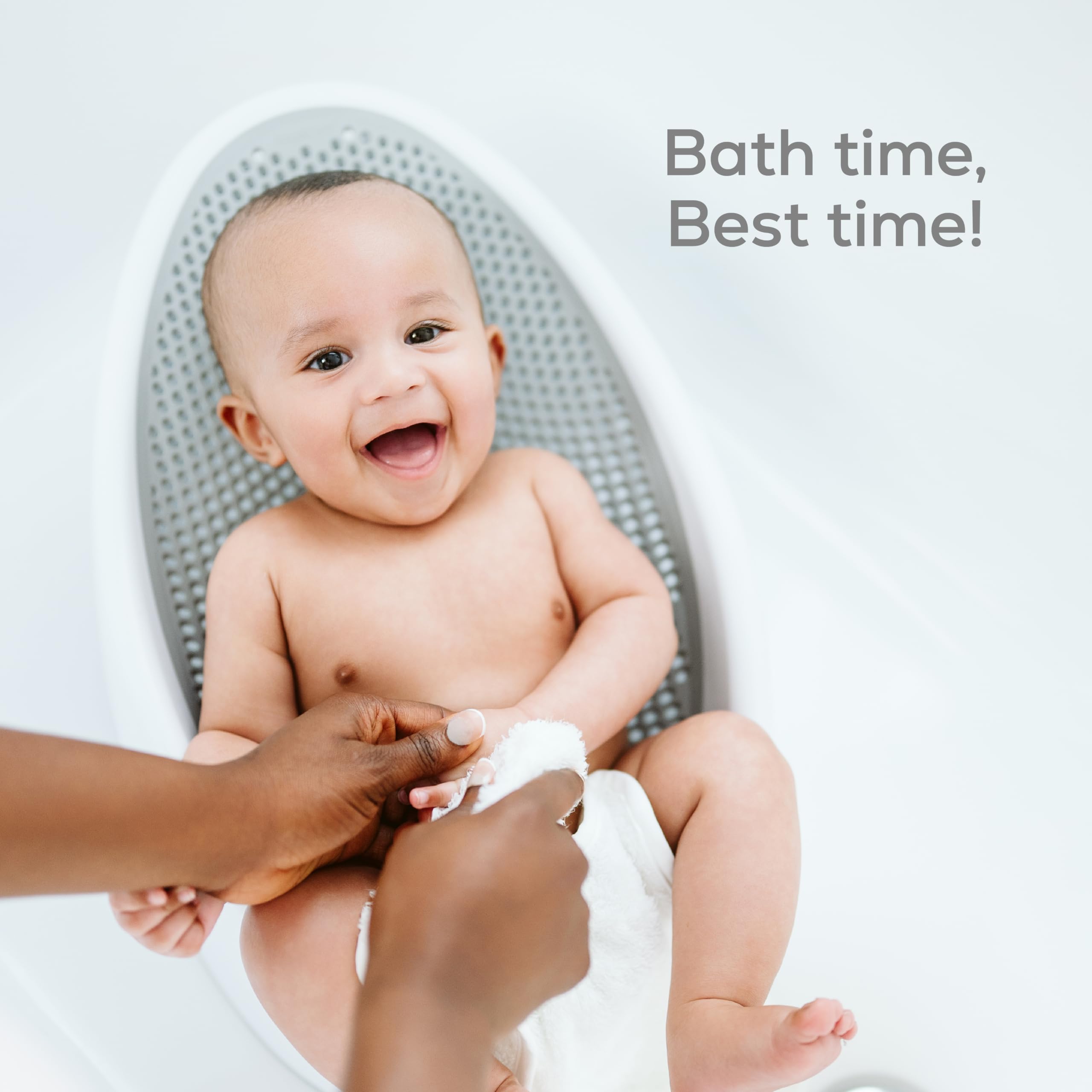 Angelcare lifestyle scene of parent bathing newborn showing calmer, safer routine