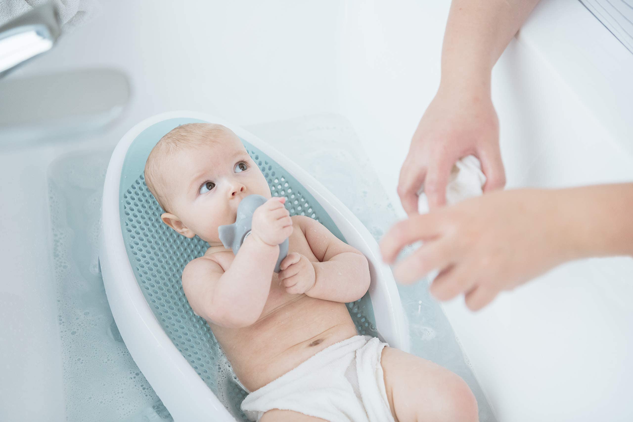 Angelcare size comparison with infant doll showing fit for newborns