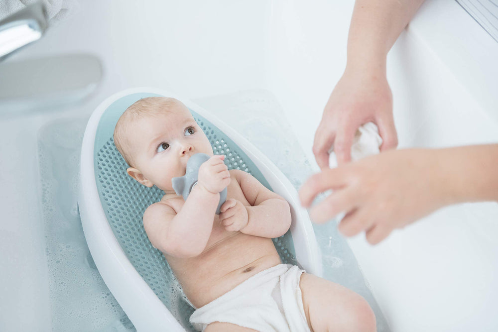 Angelcare size comparison with infant doll showing fit for newborns