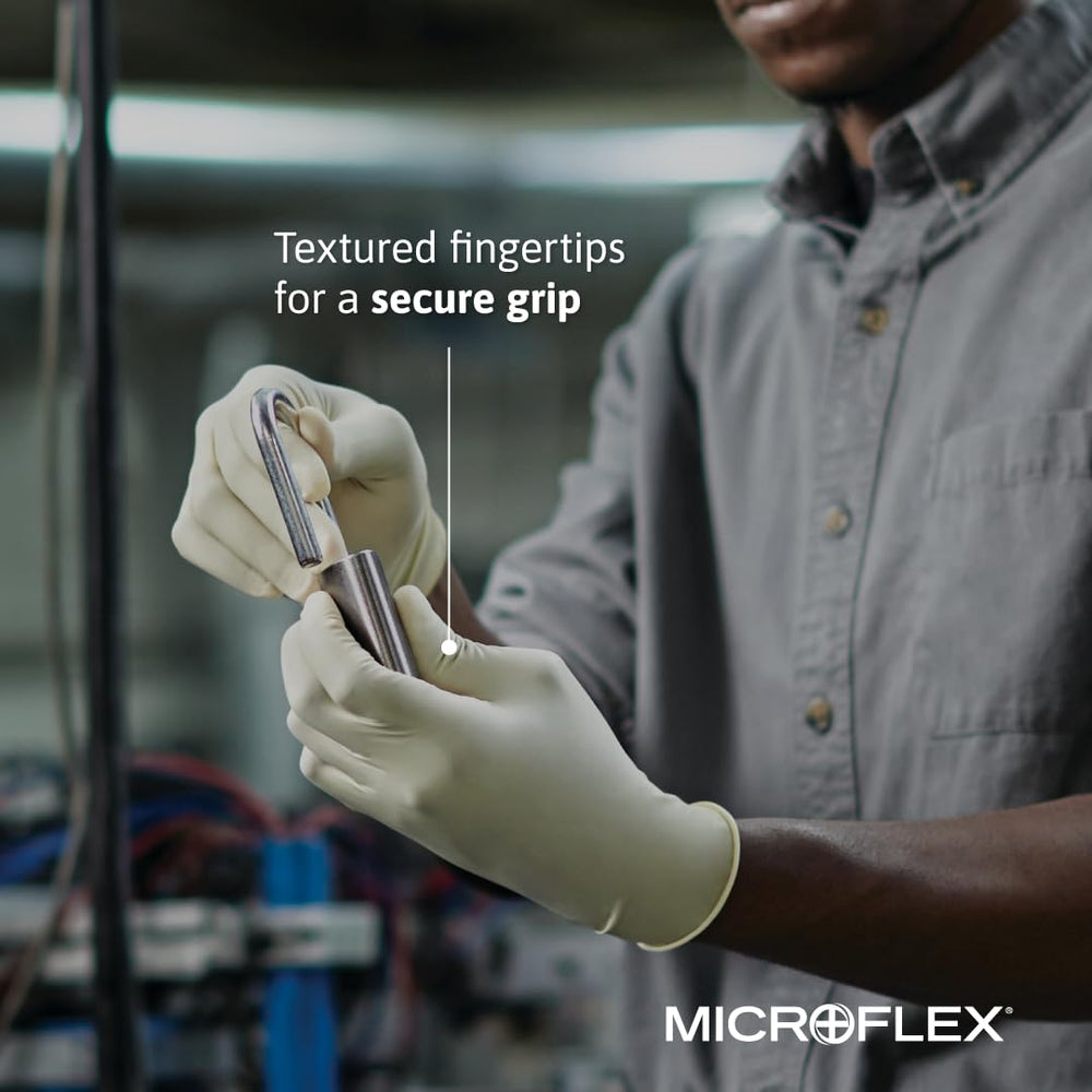 Ansell Microflex glove beside ruler showing length and thickness for sizing
