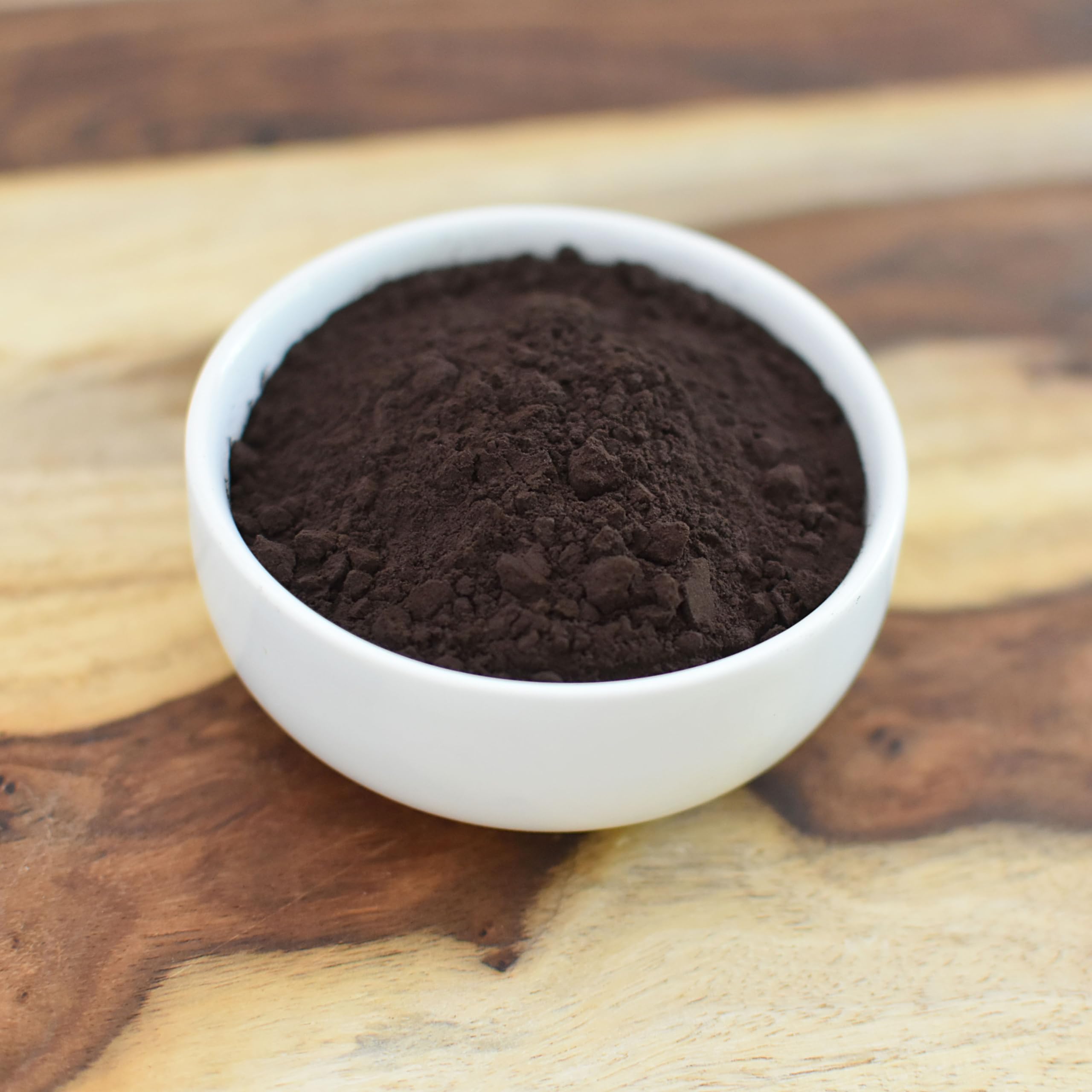 Handmade soap and scrub using Anthony's black cocoa demonstrating natural colorant use
