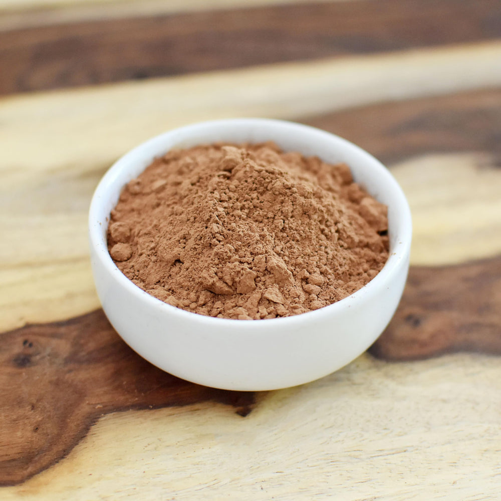 Anthony's cocoa next to measuring scale, highlights accurate portioning benefit