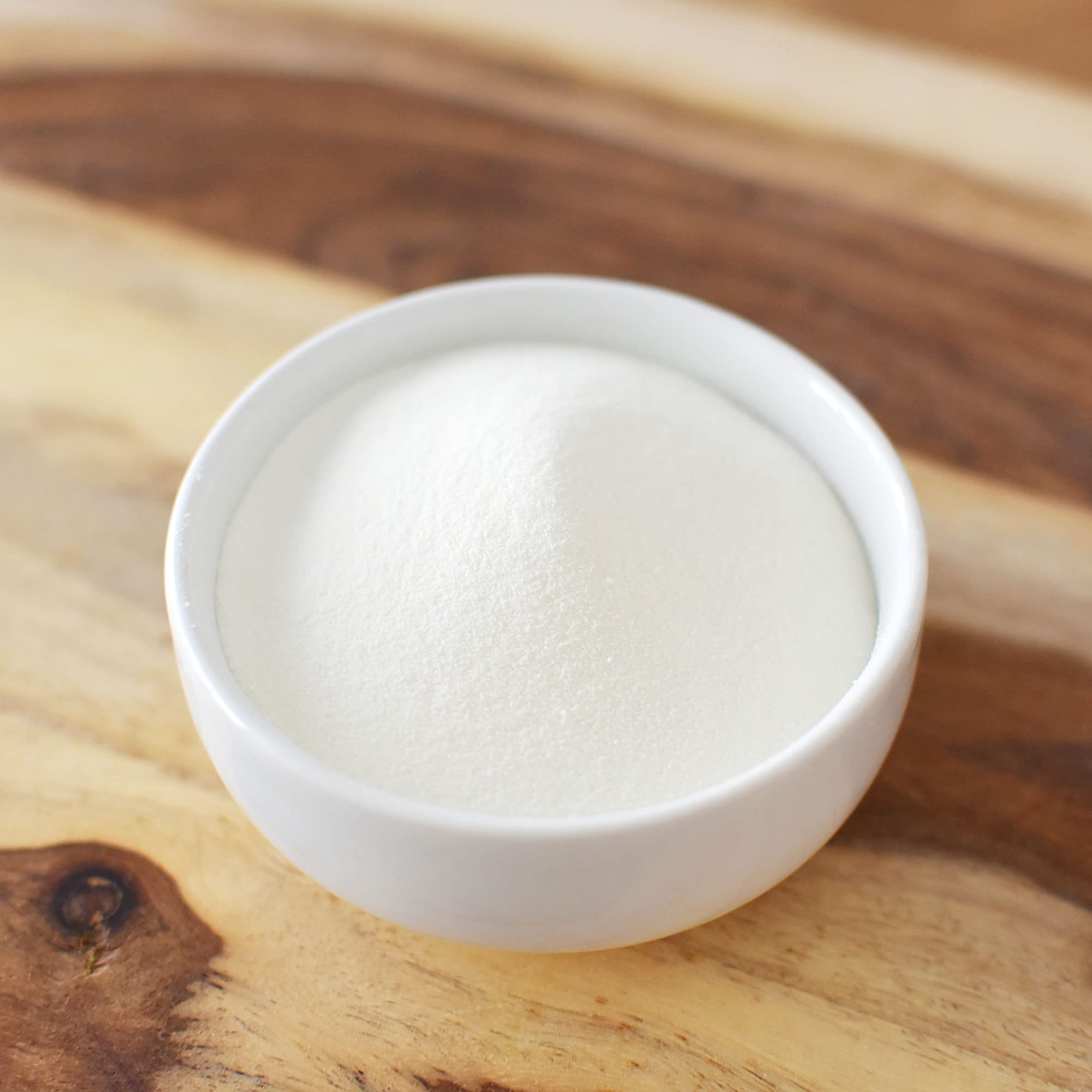 Anthony's collagen scoop beside measuring scale, visualizes serving size and protein content