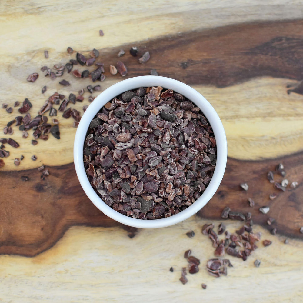 Anthony's cacao nibs sprinkled on ice cream adding crunch and deep cocoa flavor benefit