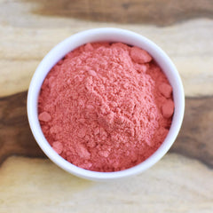 Anthony's powder on a scoop beside fruit showing portion scale and convenient use