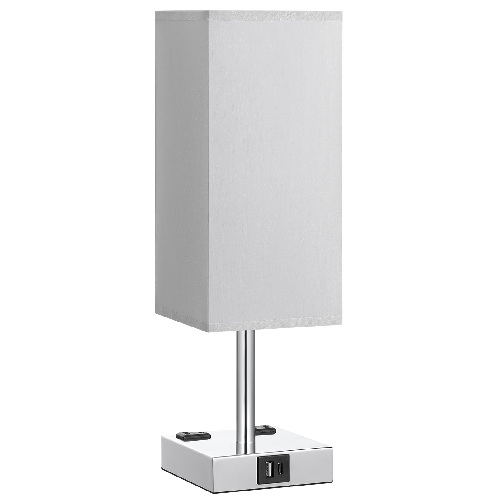 aooshine lamp next to book and phone to show compact scale and bedside fit