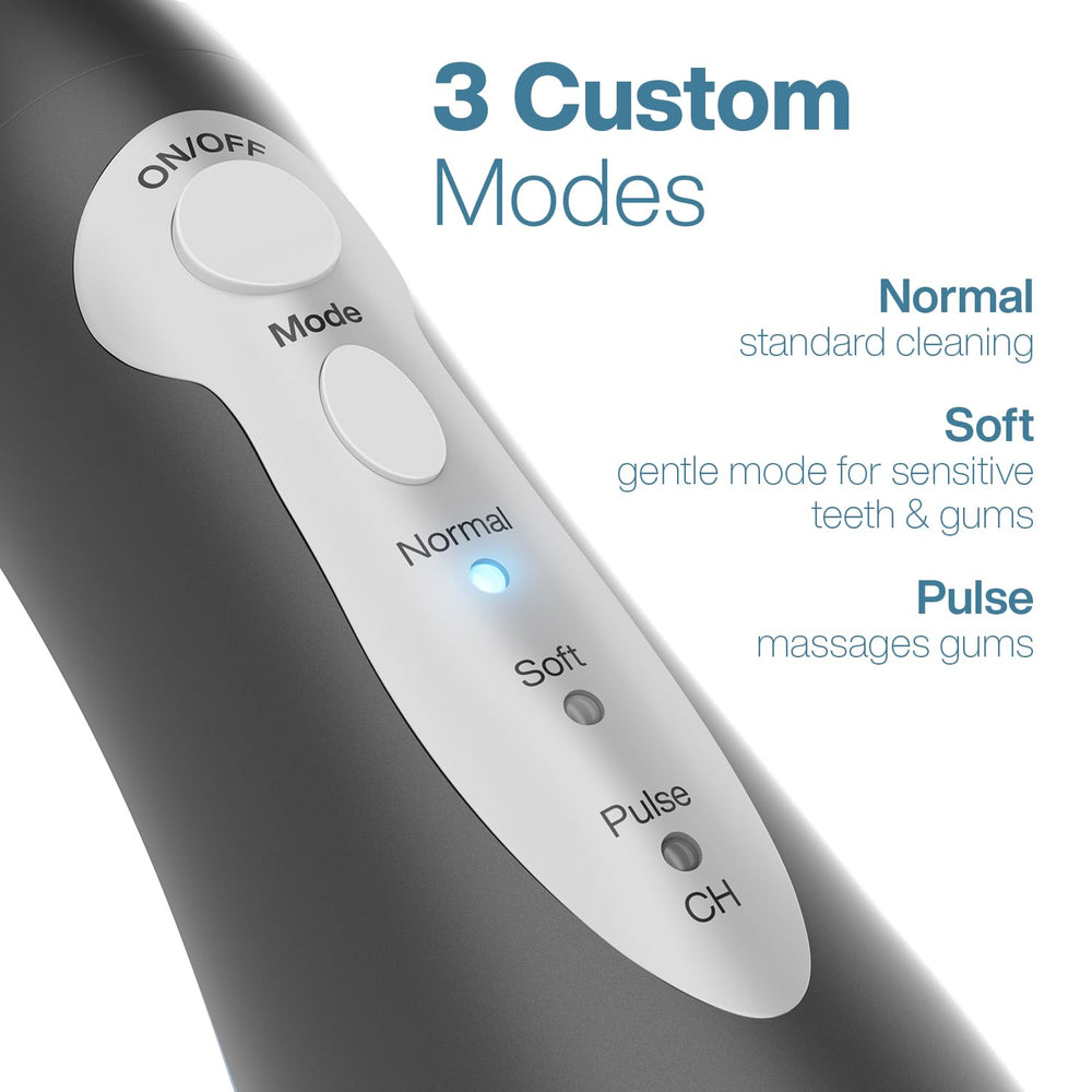 Aquasonic Aqua Flosser held in hand to show size and portable travel convenience