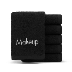 Arkwright LLC front view of six folded black cotton makeup remover cloths showing neat stack and packaging benefit