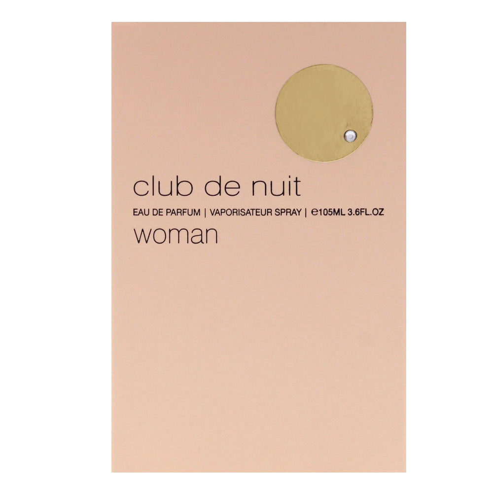 Person applying Armaf Club De Nuit mist demonstrating wearable, long-lasting scent
