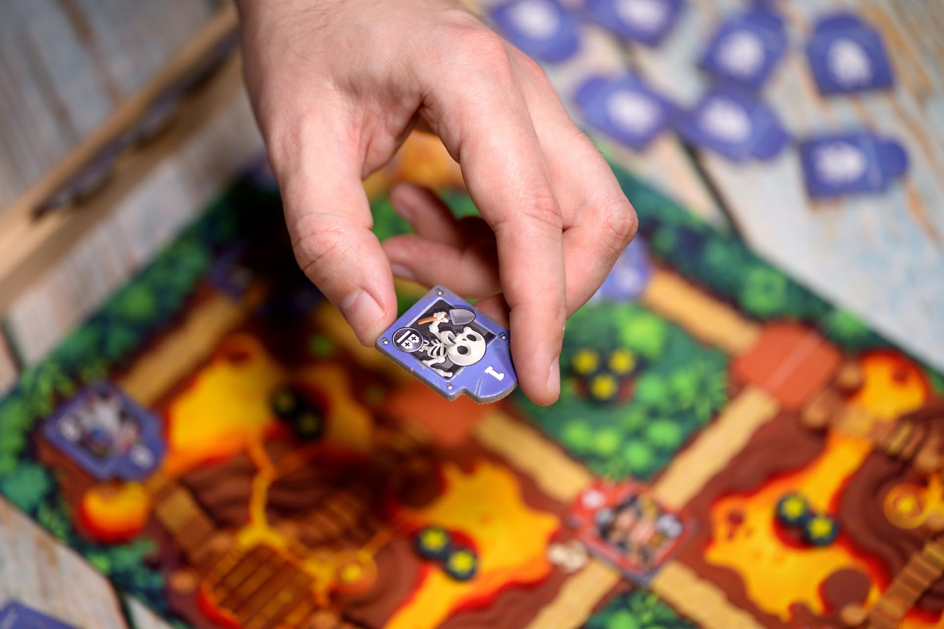 Asmodee Toy Battle tile held in hand showing scale and travel-friendly portability