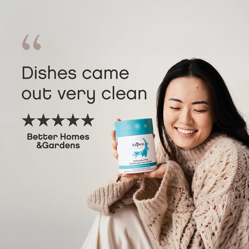 AspenClean pod beside a hand to show single-dose size and ease
