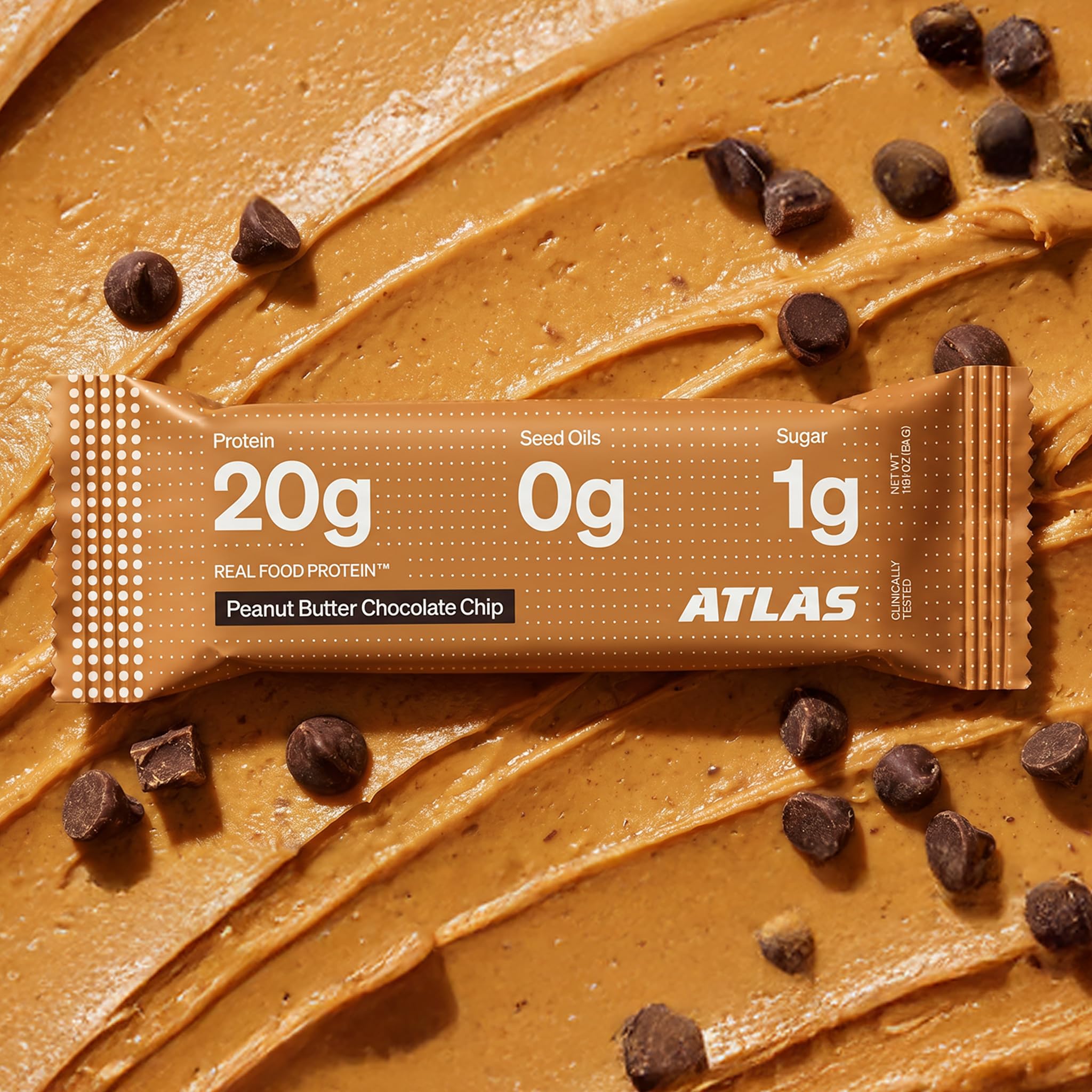 Atlas Protein Bar ingredients spread with roasted peanuts and almonds emphasizing whole-food sourcing