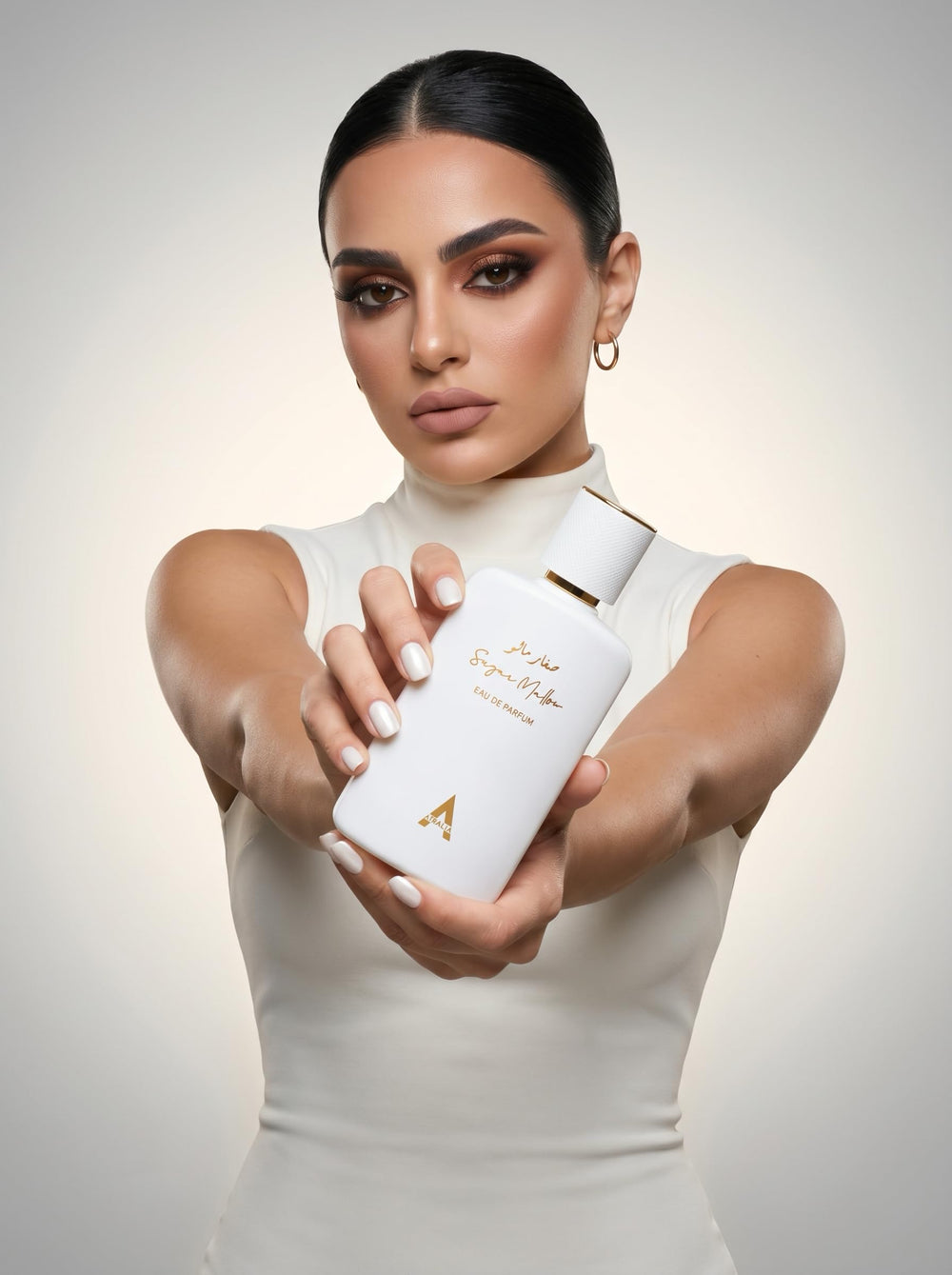Atralia bottle in hand for scale showing 100ml size and portability