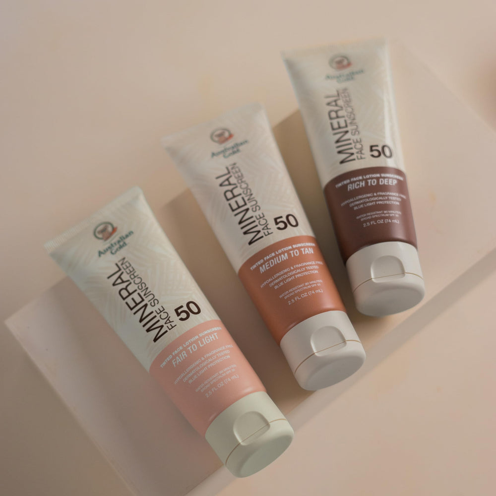 Australian Gold tube peeking from a beach bag showing daily sun-care convenience and on-the-go protection benefit