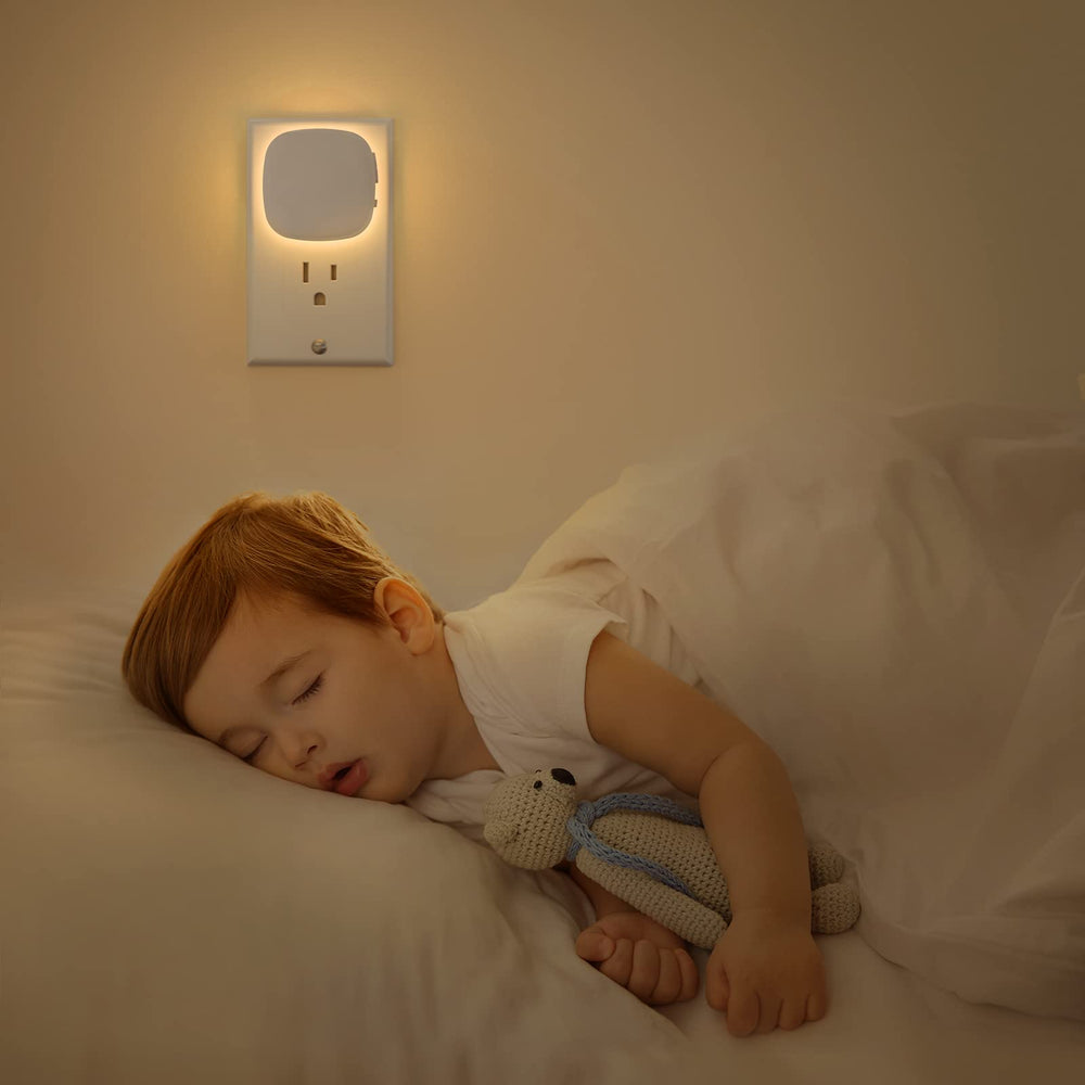 AUVON next to nightstand scaled to show size and subtle bedside lighting