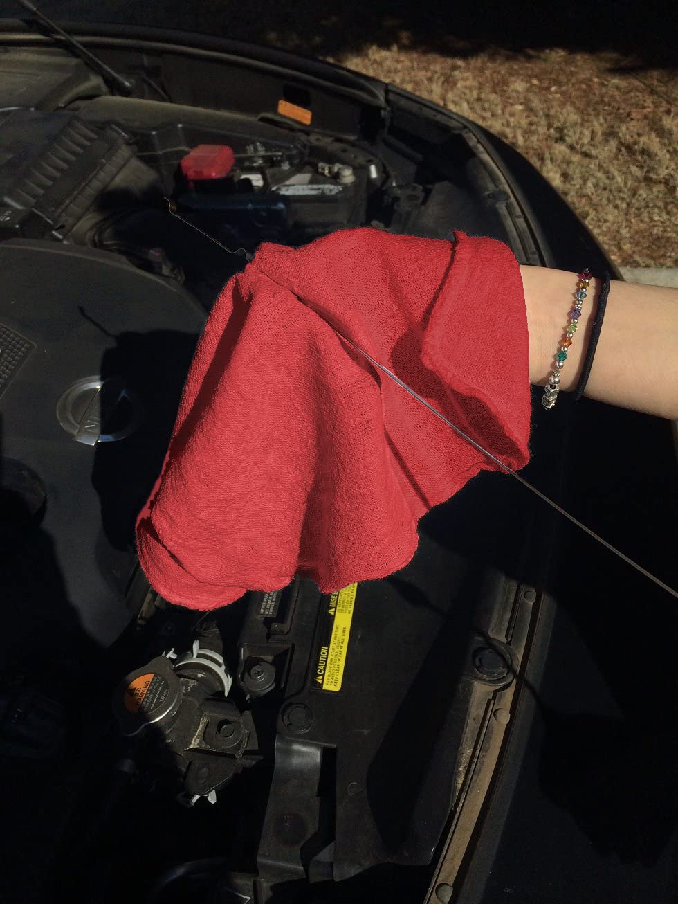 Avalon Towels towel held in hand showing convenient 12x14 size