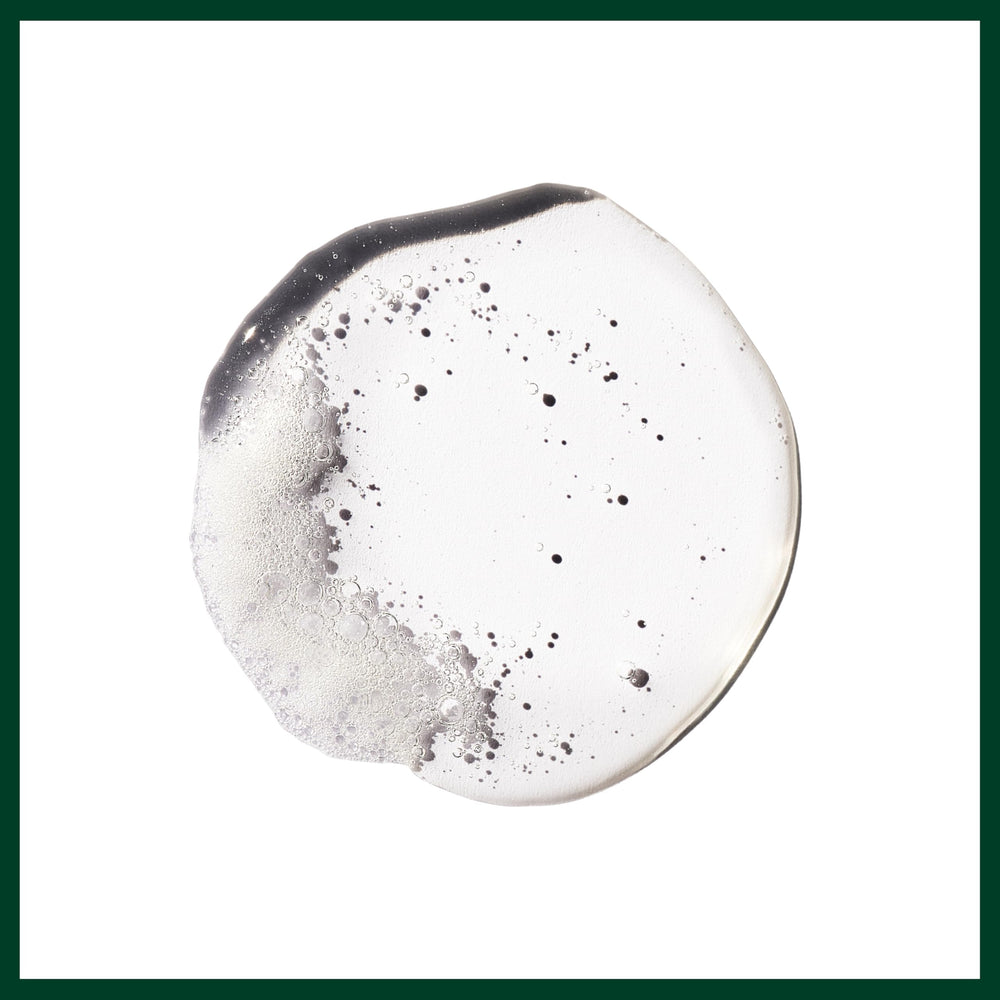 Aveda Flax Seed Aloe used to create a slicked-back hairstyle demonstrating sleek finish
