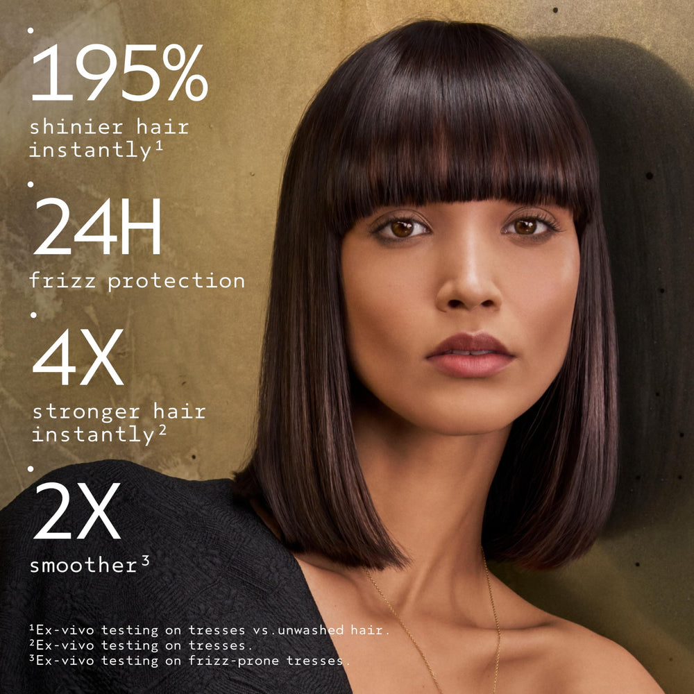 Aveda Miraculous Oil pouring texture demonstrating lightweight sheen benefit: visible non-greasy finish
