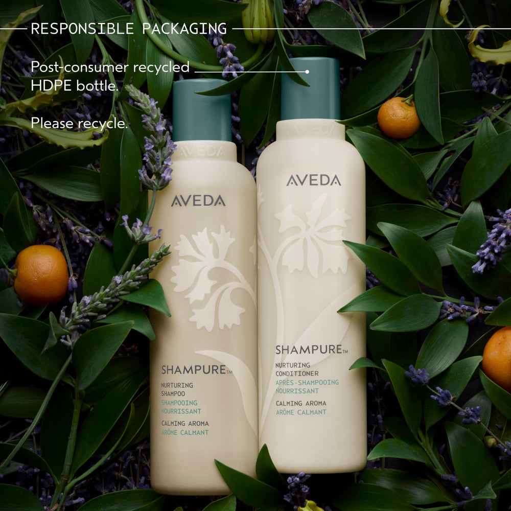 Aveda Shampure on bathroom shelf with towels, suggests daily ritual