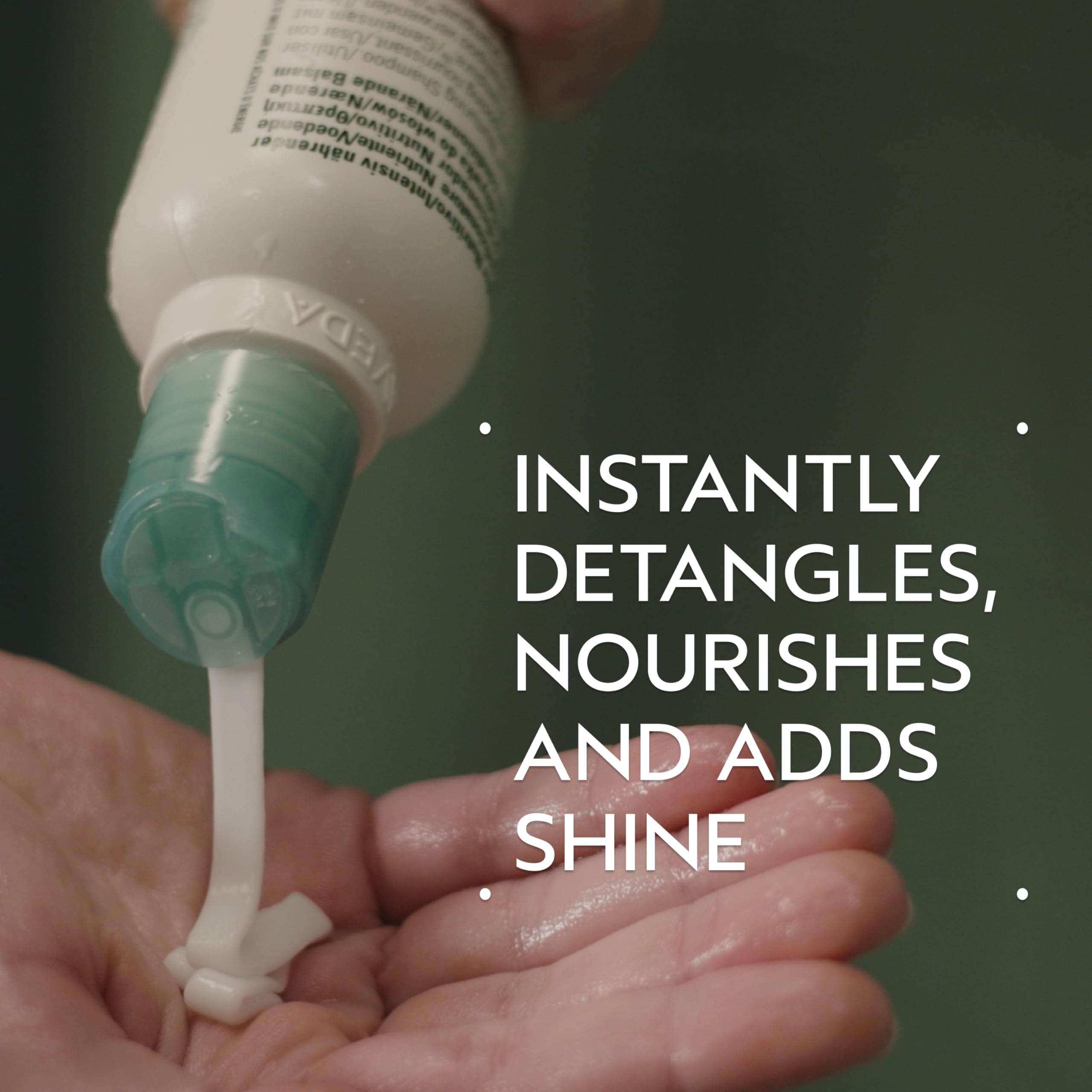 Aveda Shampure cream texture on palm, shows lightweight consistency