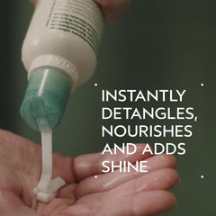 Aveda Shampure cream texture on palm, shows lightweight consistency