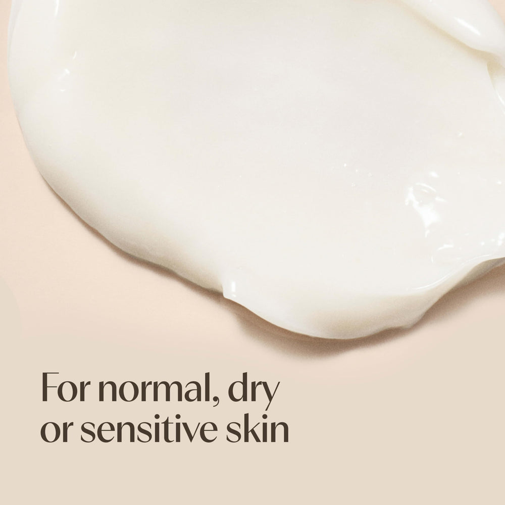 Aveeno label close-up showing prebiotic oat and shea butter benefits