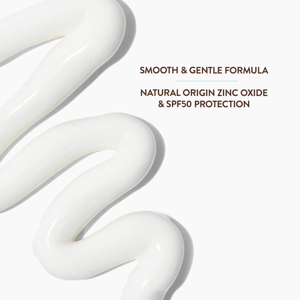 Applying Babo Botanicals sunscreen on baby arm for visible coverage benefit