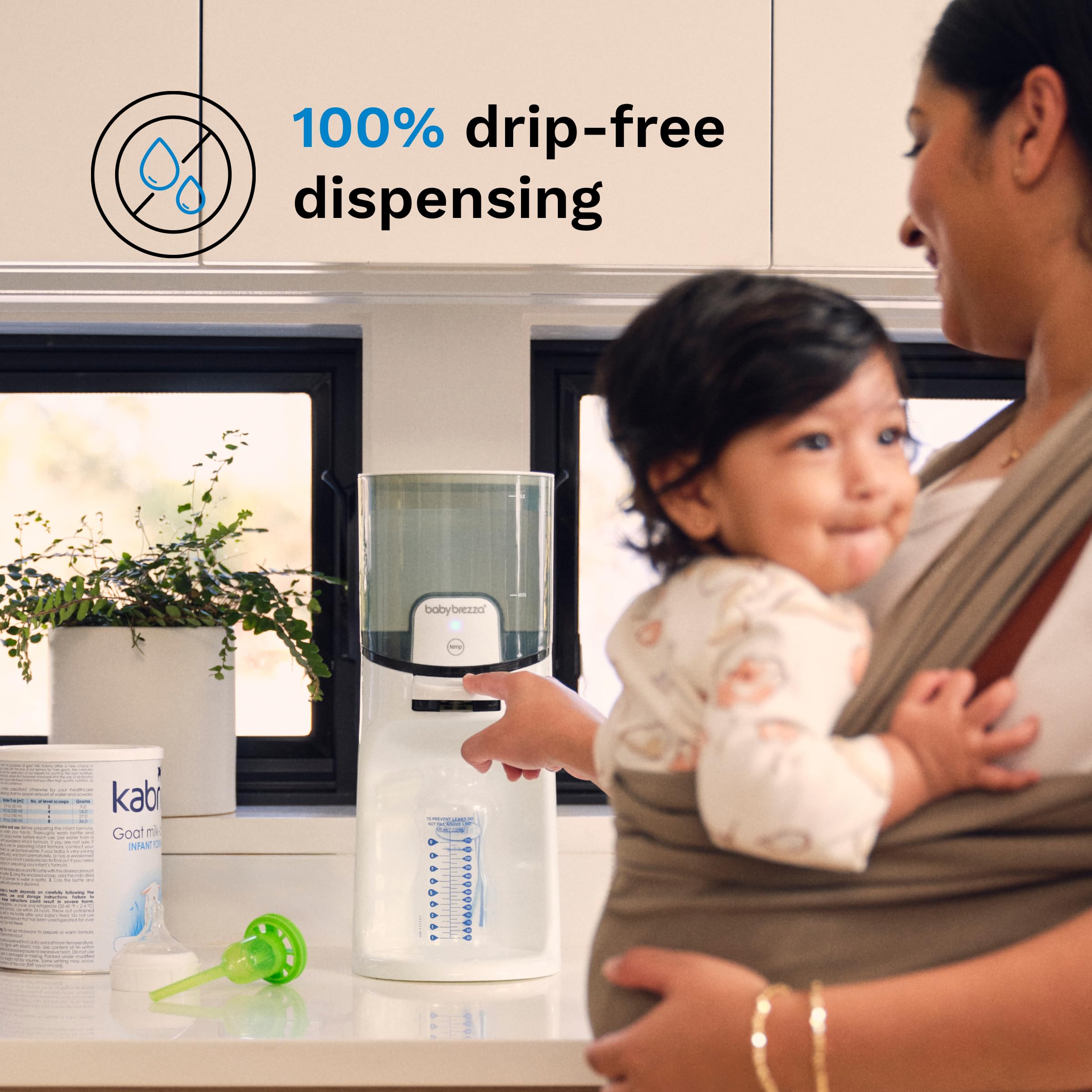 Baby Brezza next to bottles to show compact size and capacity
