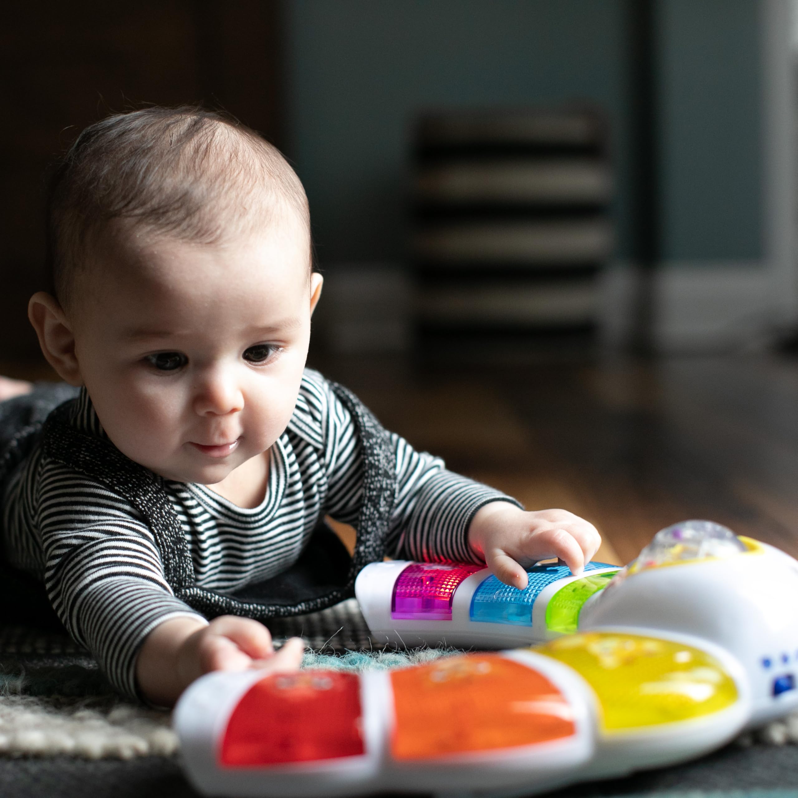 Baby Einstein color mode labels in three languages, supports early language