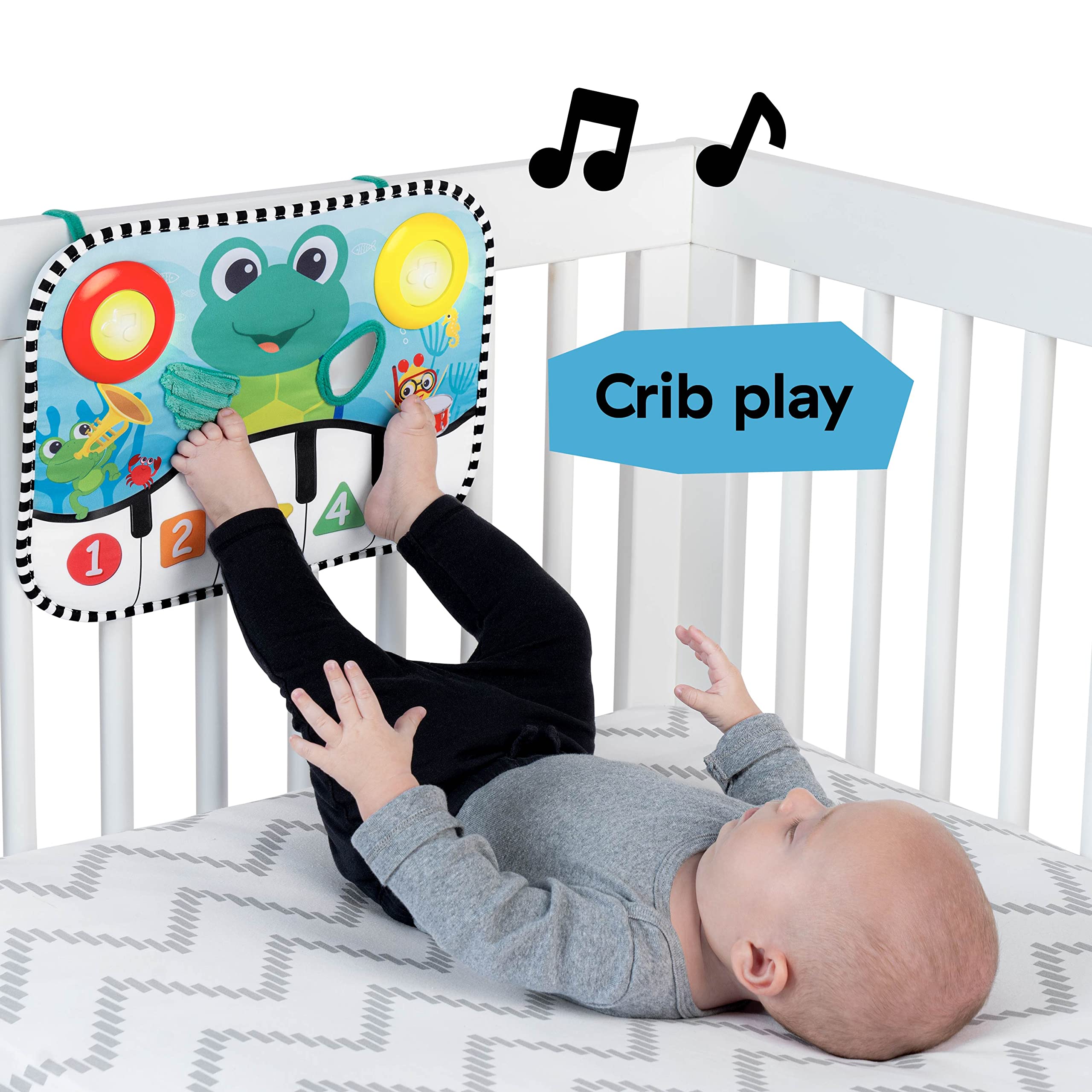 Baby Einstein pad attached to crib demonstrating hands-free kick activation benefit