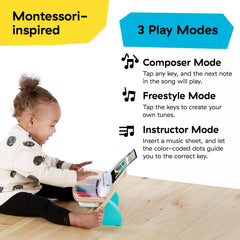 Baby Einstein toddler touching a note demonstrating Magic Touch ease and immediate sound feedback benefit