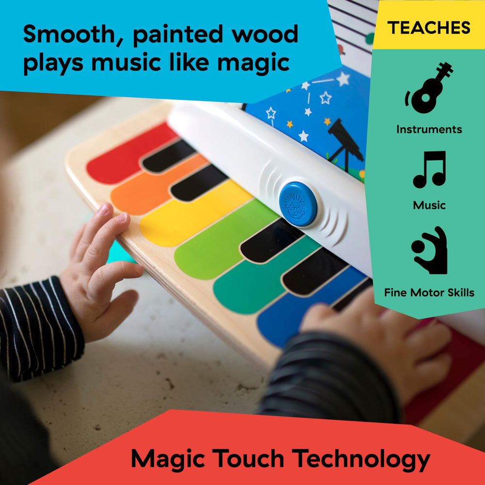 Baby Einstein piano with three music sheets showing guided play and beginner song practice benefit