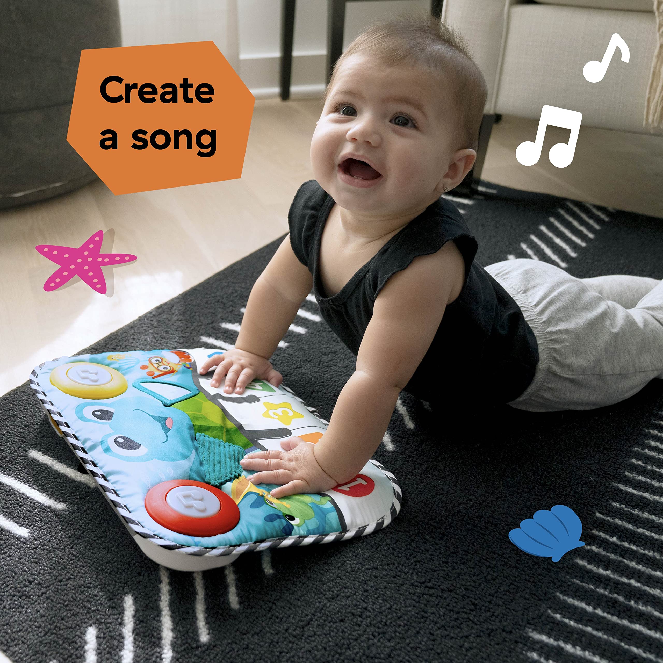 Baby Einstein beside a ruler showing product dimensions for sizing clarity