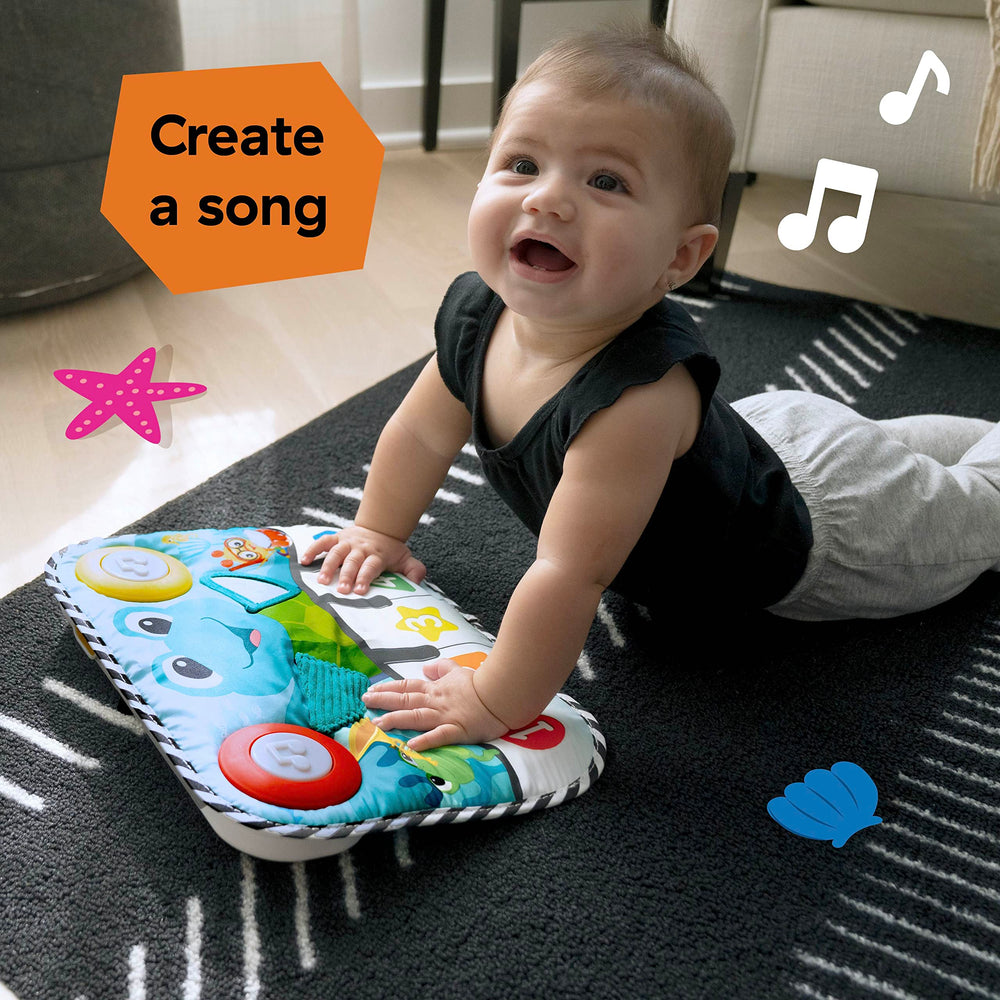 Baby Einstein beside a ruler showing product dimensions for sizing clarity