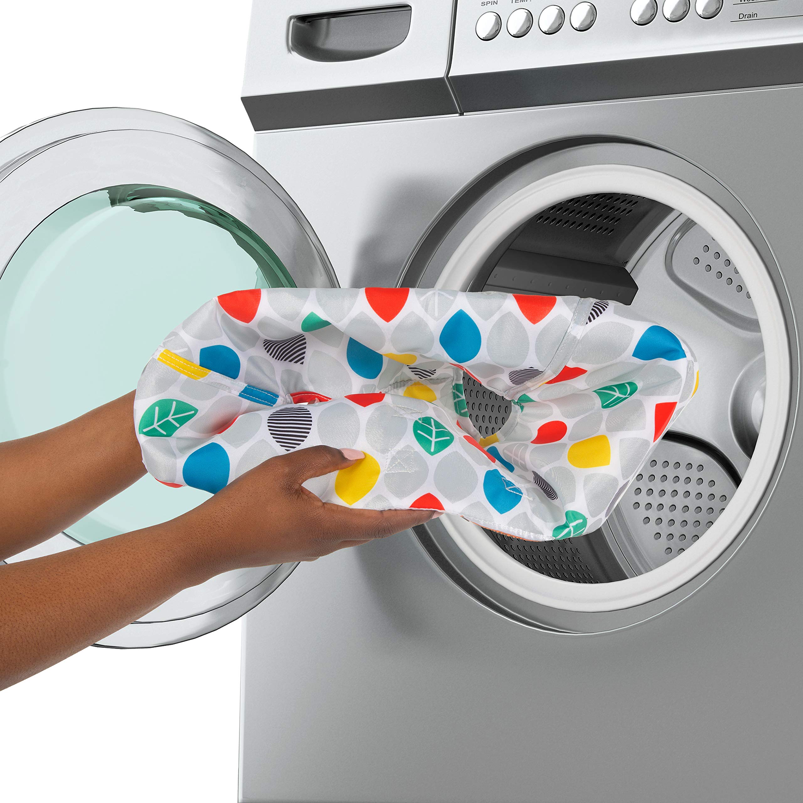 Baby Einstein wipe-clean surface being quickly cleaned by caregiver