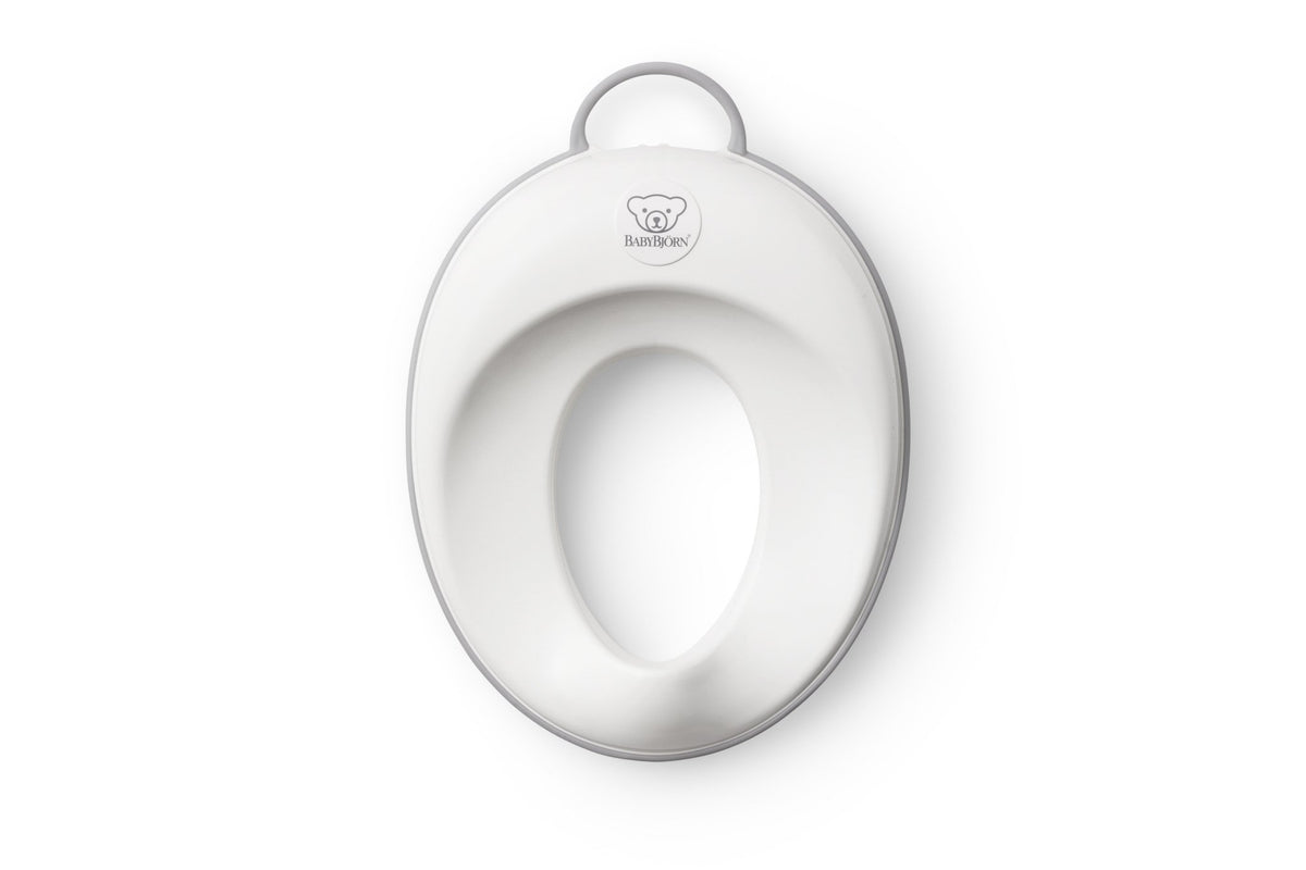 BabyBjörn toilet trainer front view showing white and gray ergonomic seat for comfort