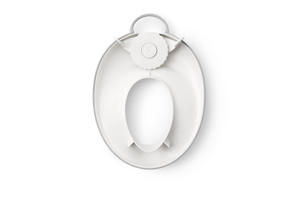 BabyBjörn toilet trainer placed on adult toilet in bathroom setting for easy fit demonstration