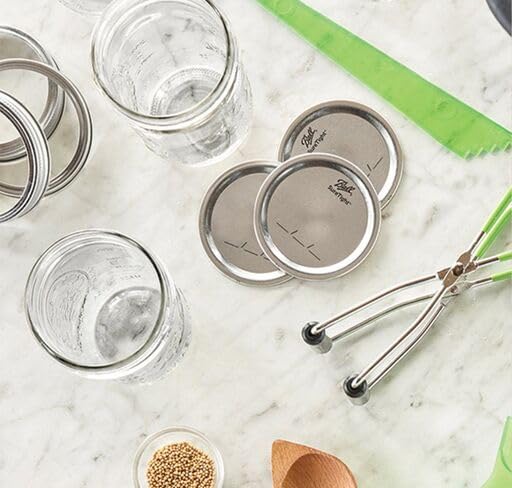 Ball lids sealed on a wide-mouth Mason jar preserving homemade goods