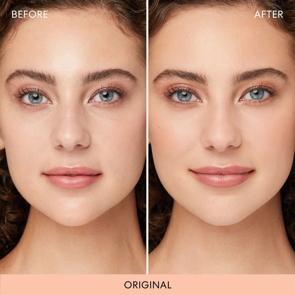 bareMinerals brush sweeping powder across cheek to set makeup and mattify benefit