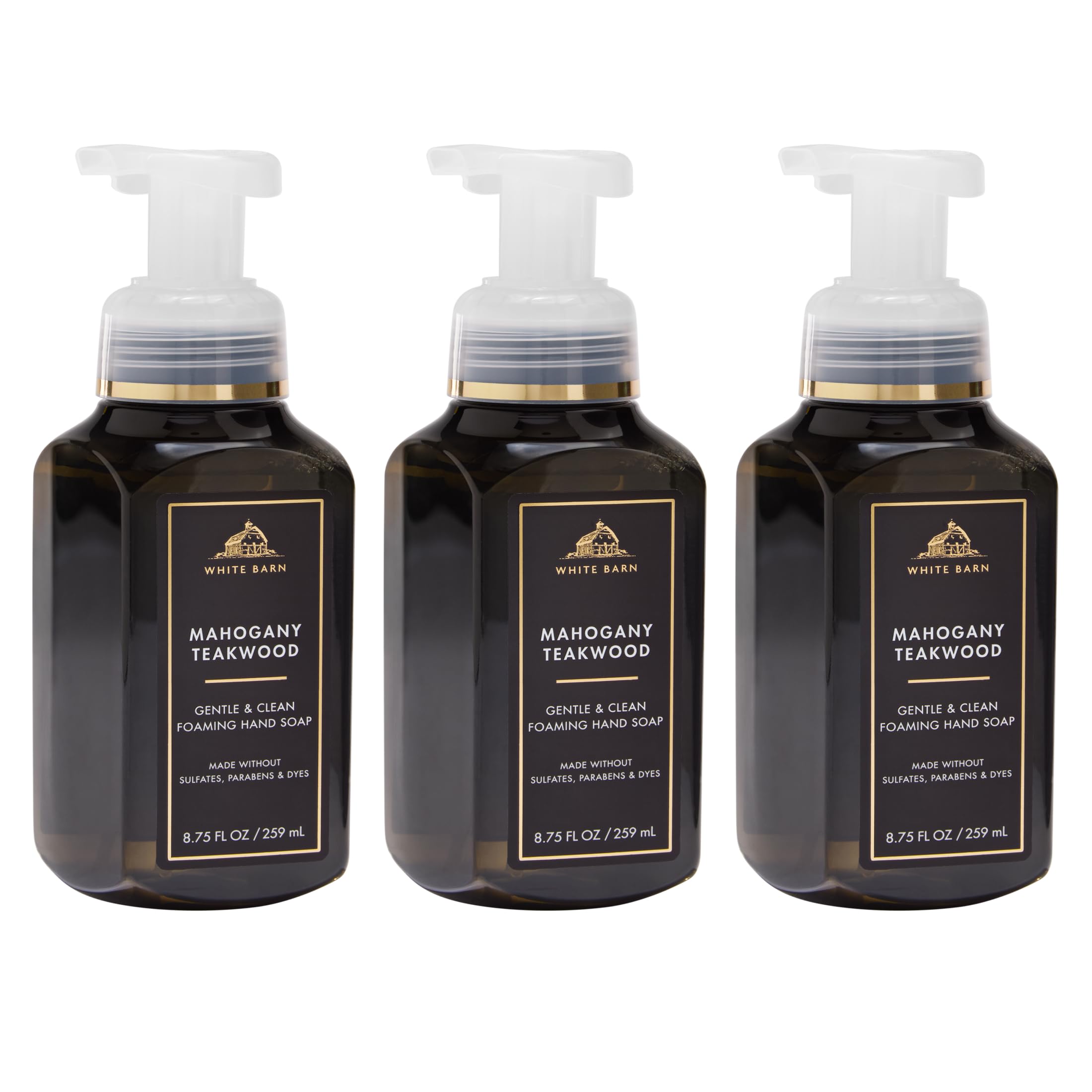 Bath & Body Works front packaging showing three bottles and warm woodsy scent benefit