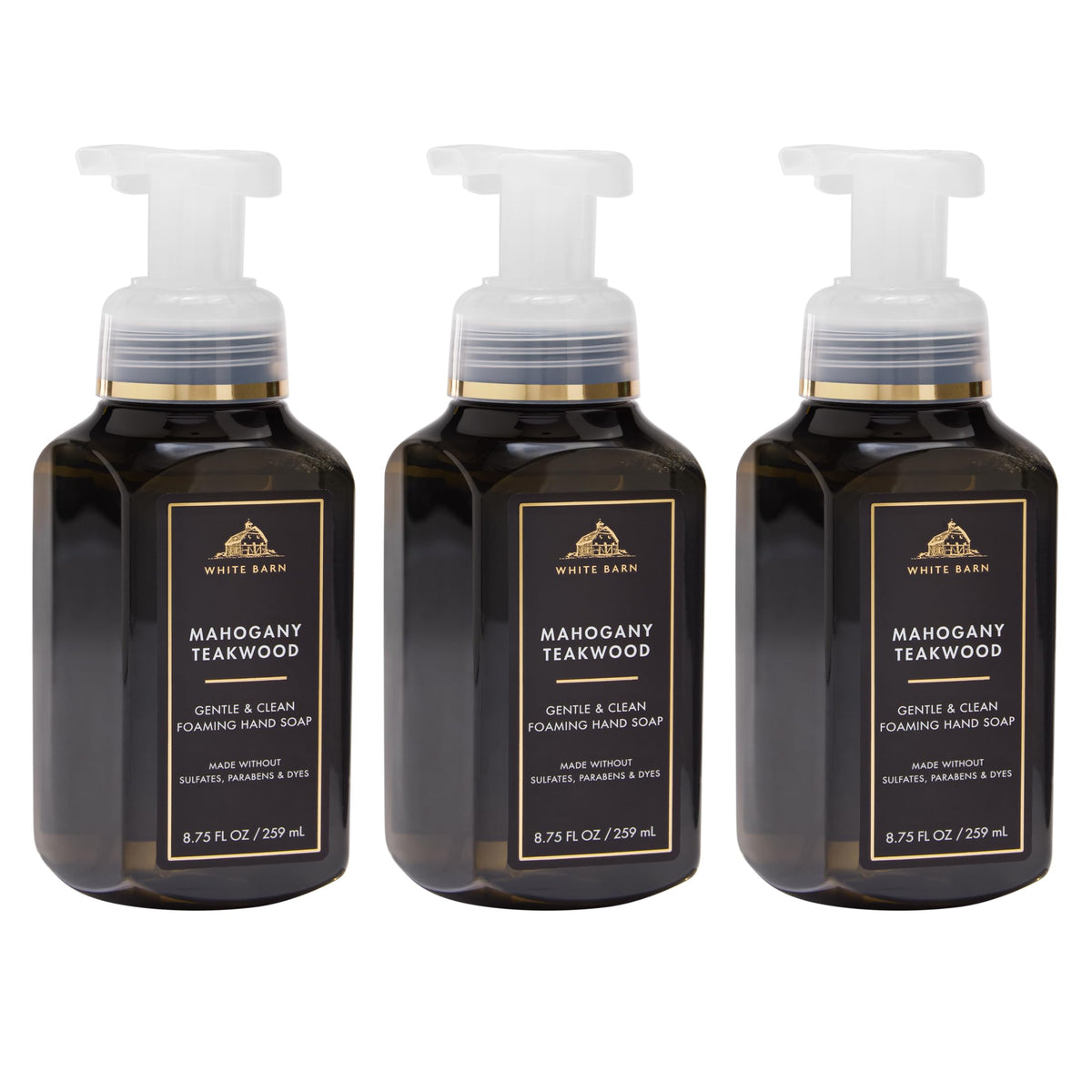 Bath & Body Works front packaging showing three bottles and warm woodsy scent benefit