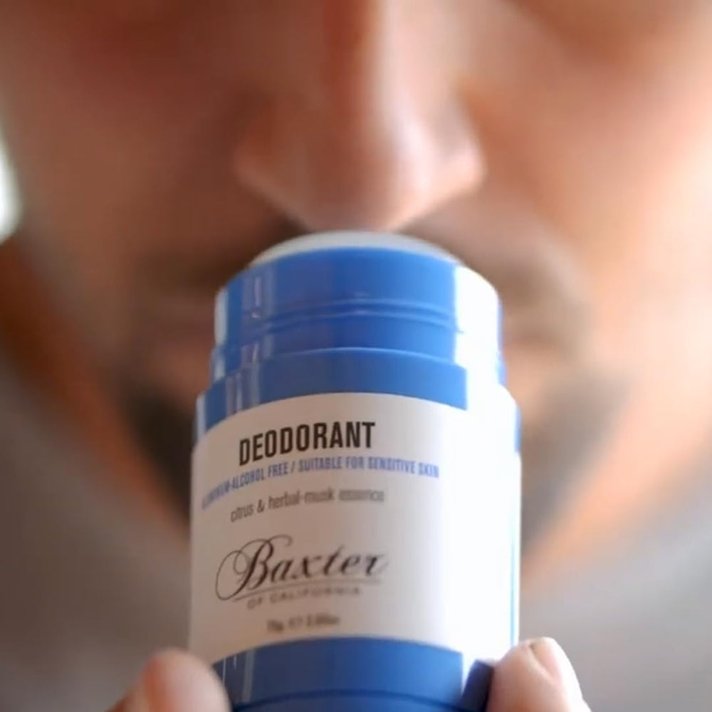 Baxter of California size and scale next to hand showing travel-friendly benefit