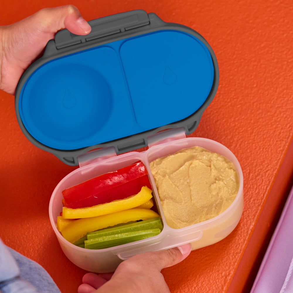 b.box large grip clips being opened by a child’s hand to promote independent use