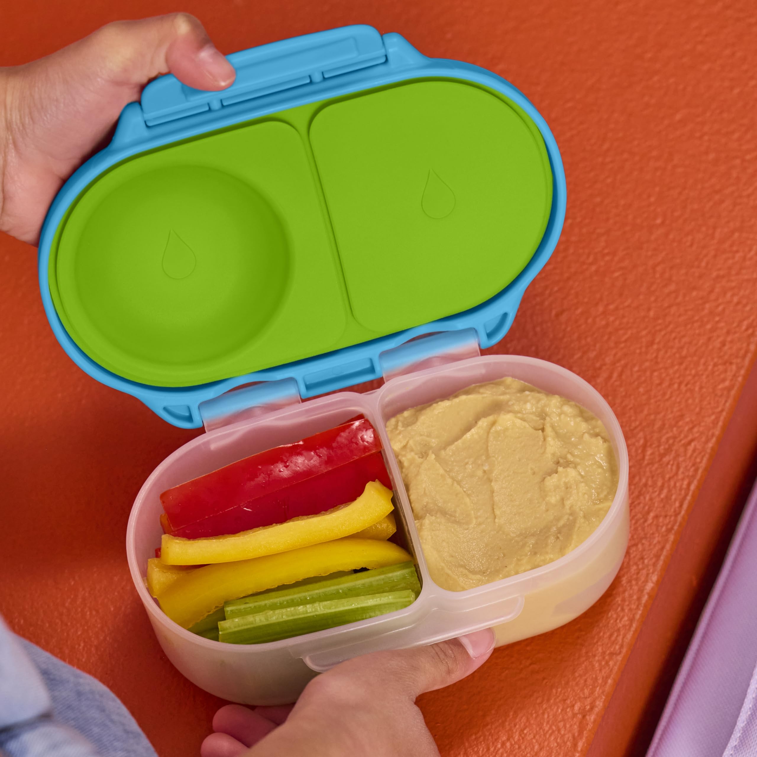 b.box large grip clips shown being opened by a small child for independence