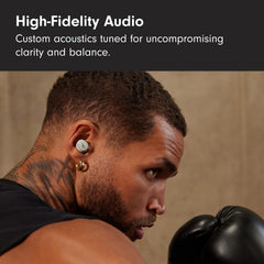 Beats Solo Buds earbud close-up detailing dual-layer driver and sound clarity benefit