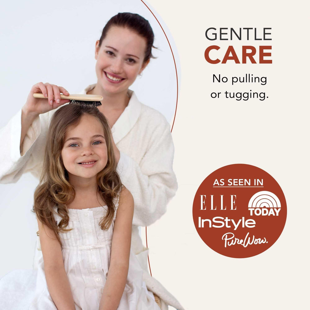 Beauty by Earth brush detangling wet hair gently to reduce breakage