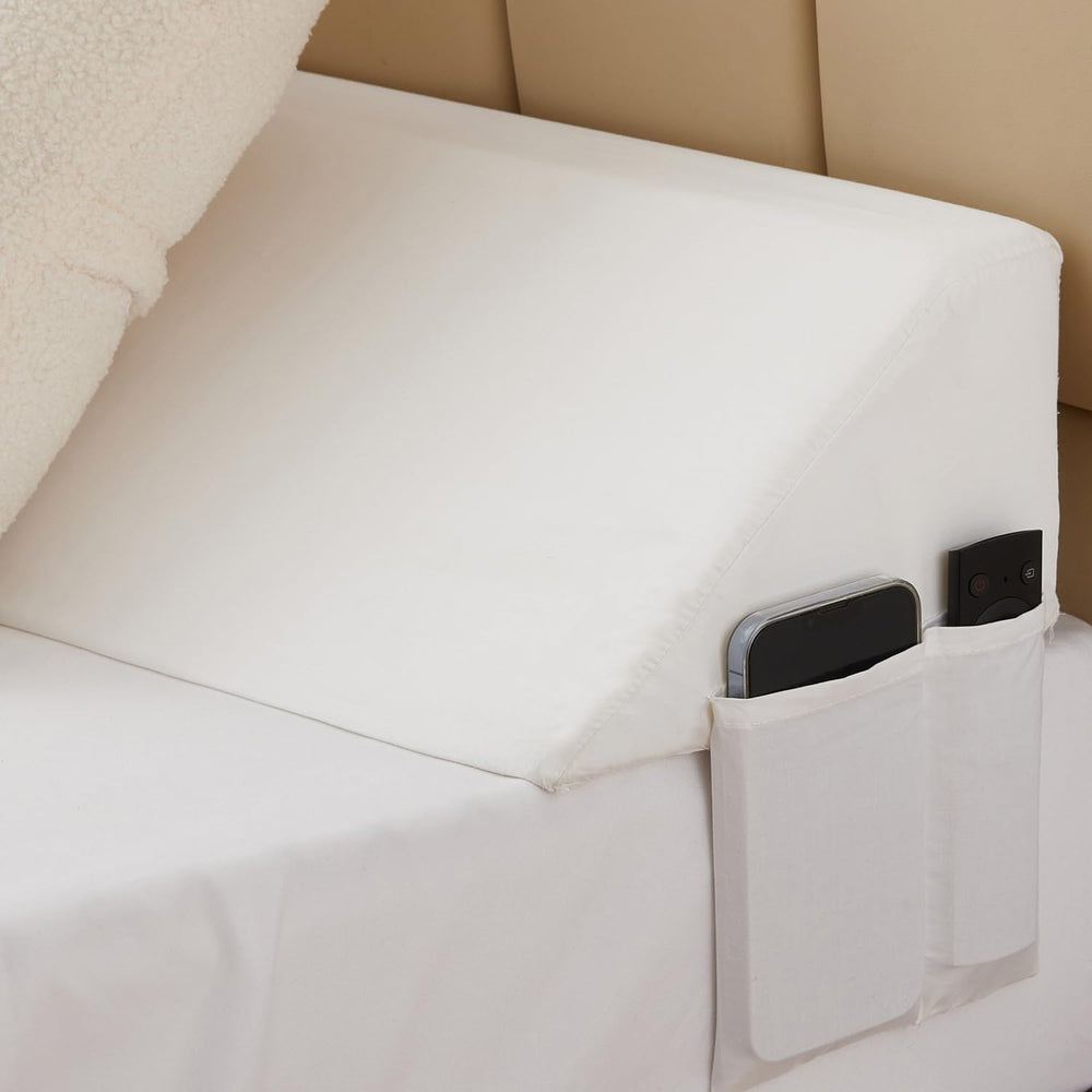 Bedluxe close-up of side pockets holding phone and remote for convenience