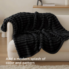 Bedsure black throw under a dog shows pet comfort and furniture protection benefit