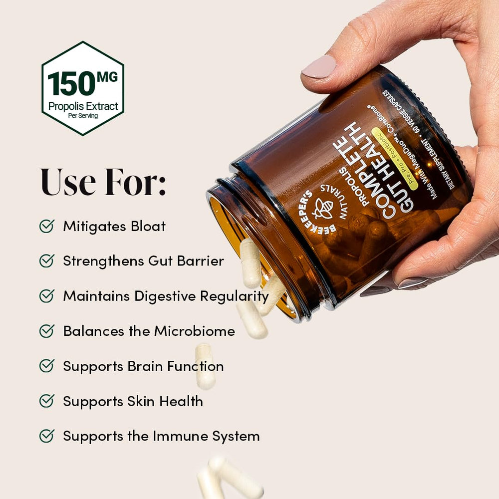 Beekeeper's Naturals loose capsules spread to show capsule texture and color