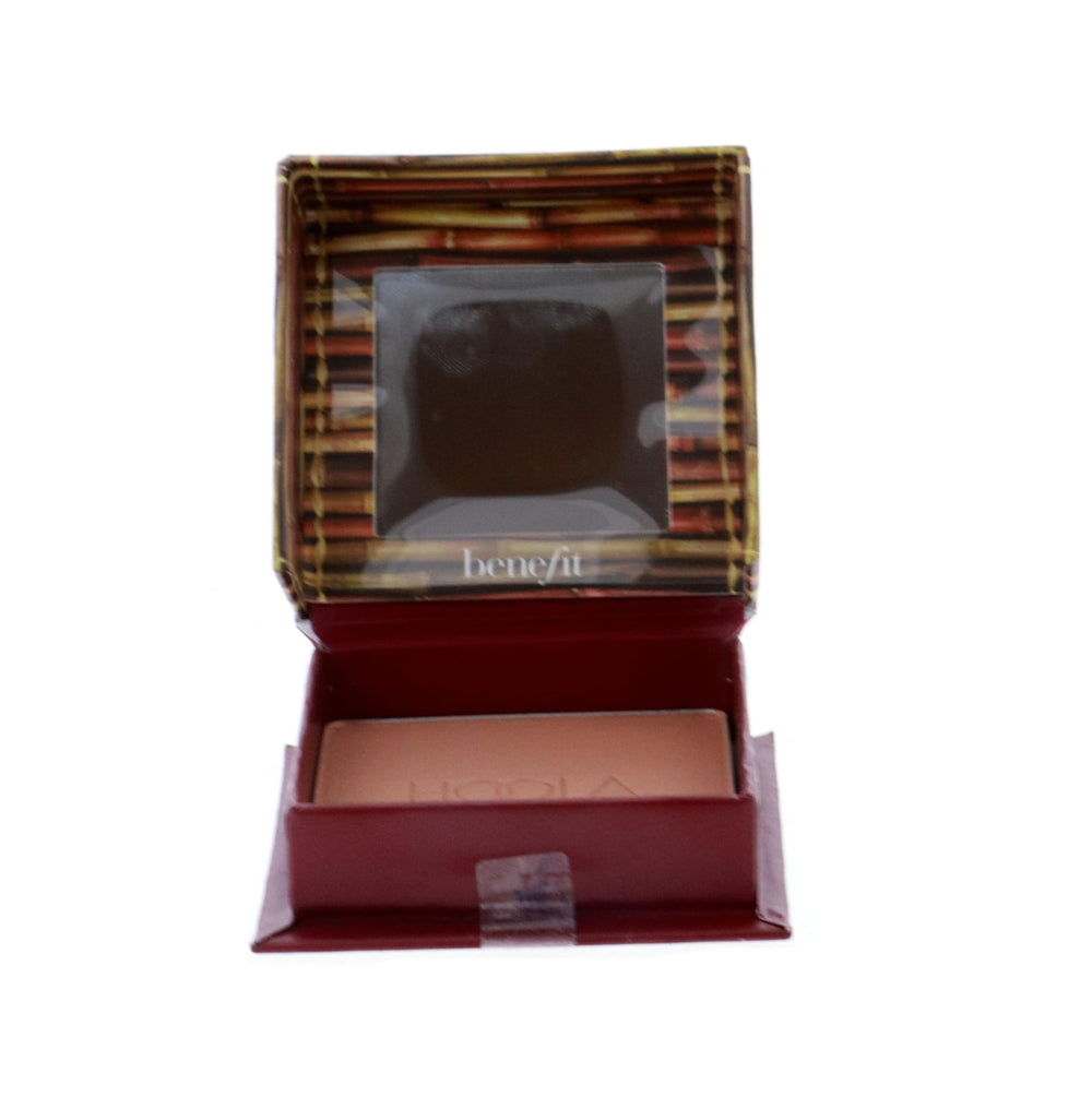 Benefit Hoola compact held in hand showing scale and travel-friendly size